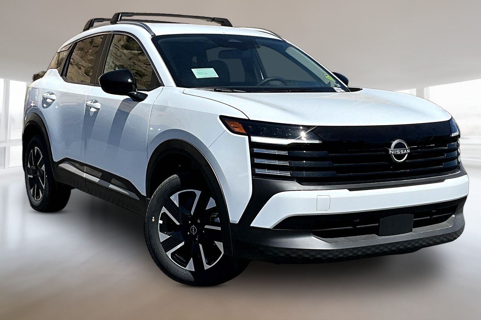 2026 Nissan Kicks SV in Fresh Powder — front three-quarter view