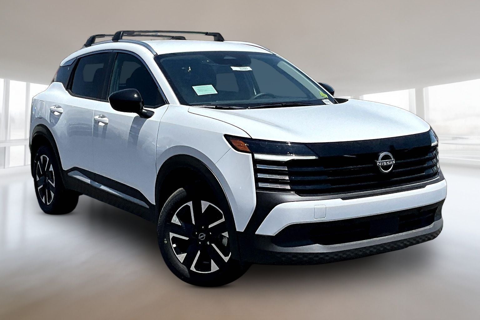 2026 Nissan Kicks SV in Fresh Powder — front three-quarter view