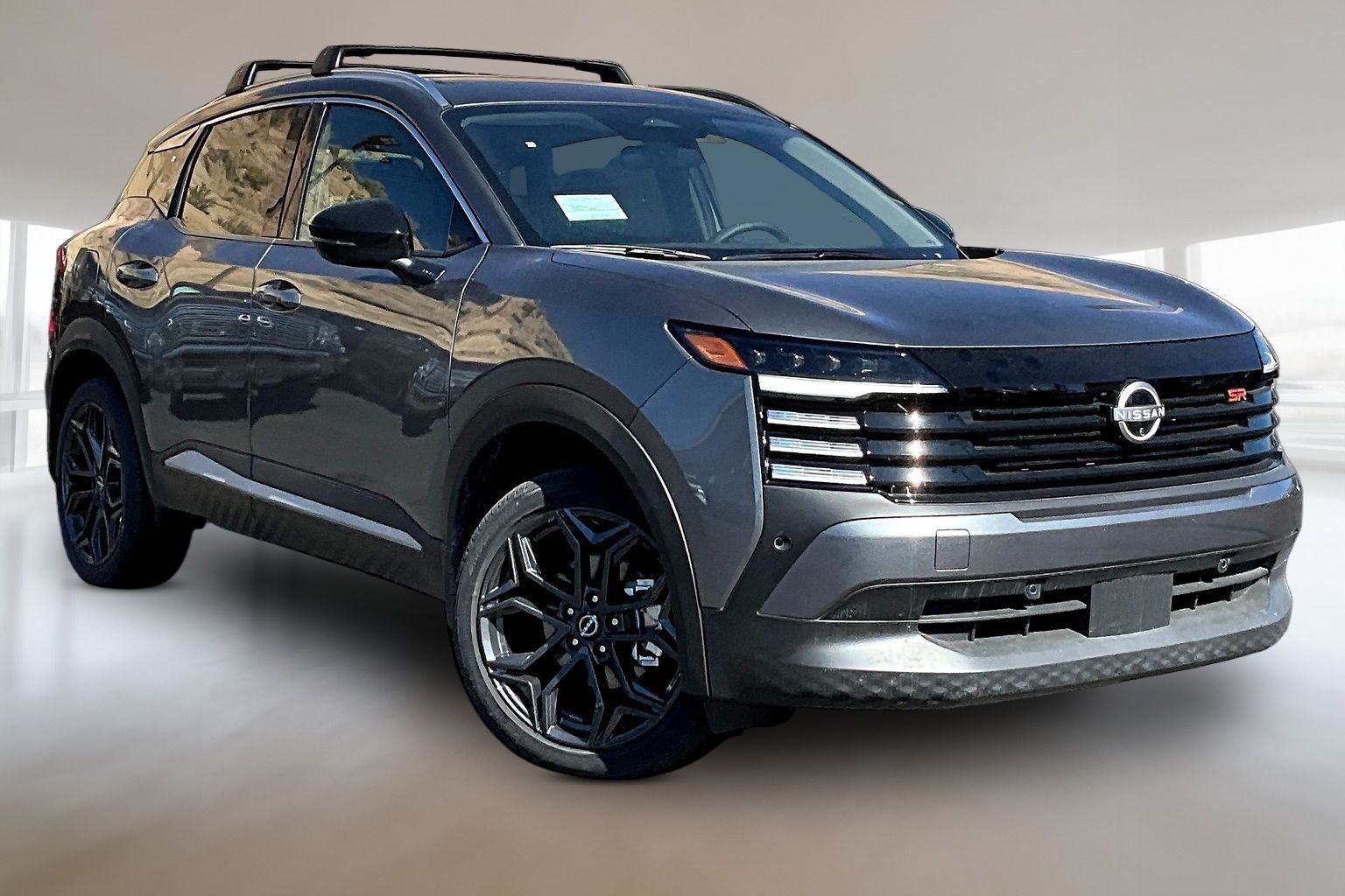 2026 Nissan Kicks SR in Gun Metallic — front three-quarter view