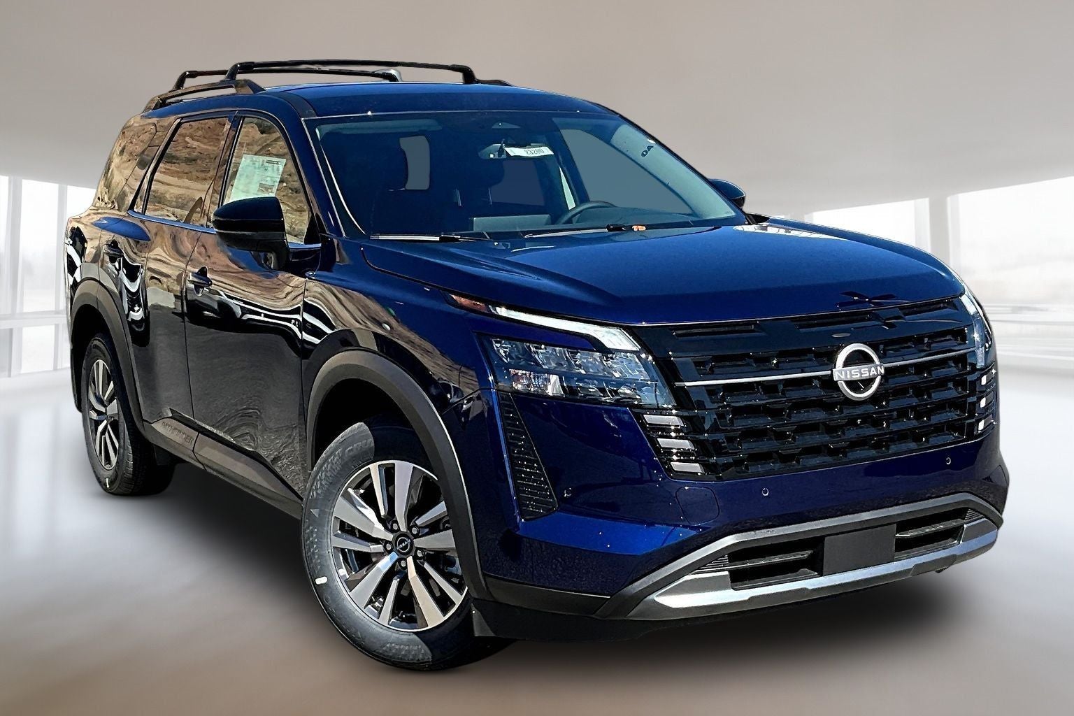 2026 Nissan Pathfinder SL in Deep Ocean Blue — front three-quarter view